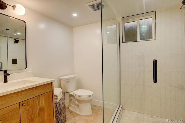 bathroom with tile patterned flooring, vanity, a baseboard heating unit, and walk in shower