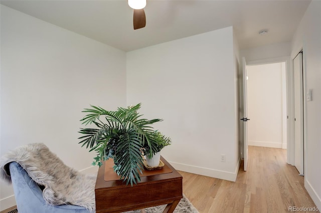 corridor with light hardwood / wood-style flooring