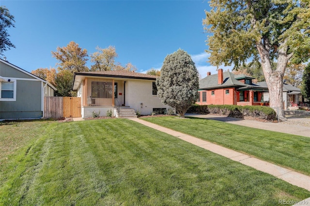 view of front of home with a front lawn