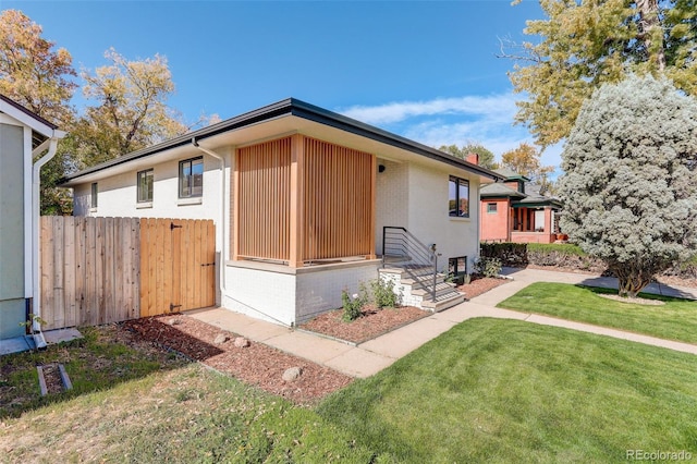 view of front of home with a front yard