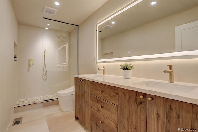 bathroom featuring vanity, toilet, and a shower