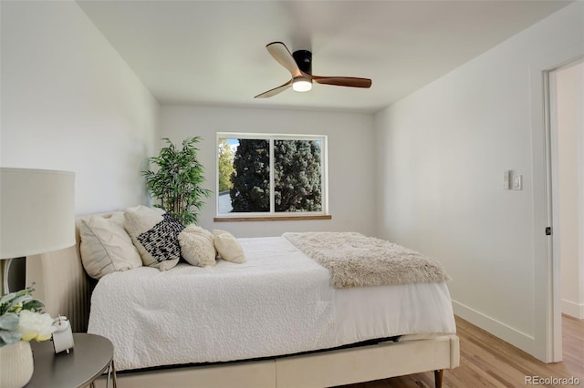 bedroom featuring ceiling fan and light hardwood / wood-style floors