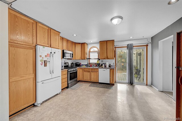 1550 S Telluride St, Aurora, CO 80017 - kitchen featuring appliances with stainless steel finishes, recessed lighting, a sink, and baseboards