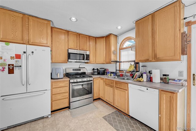 1550 S Telluride St, Aurora, CO 80017 - kitchen featuring appliances with stainless steel finishes, a sink, recessed lighting, and light countertops