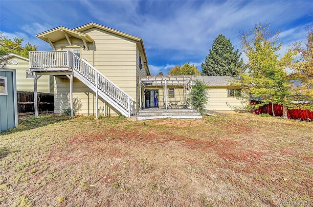 1550 S Telluride St, Aurora, CO 80017 - rear view of property with stairway, a pergola, and a deck