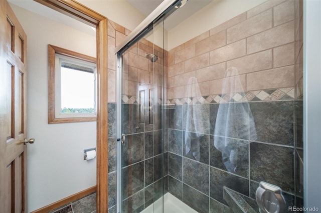 bathroom with a stall shower