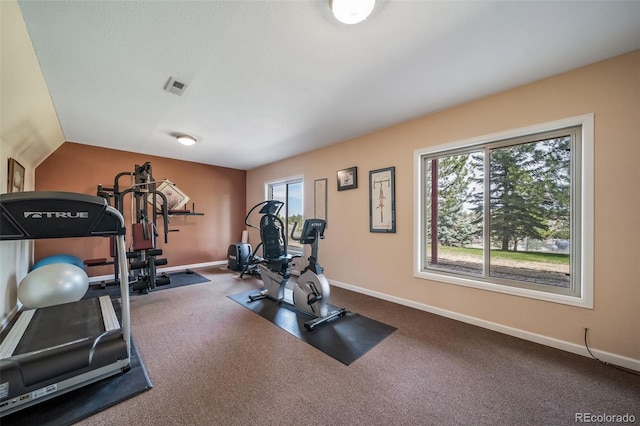 workout area featuring visible vents and baseboards