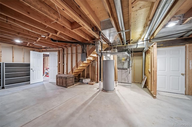unfinished below grade area with stairway and gas water heater