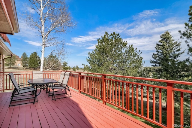 deck with outdoor dining space