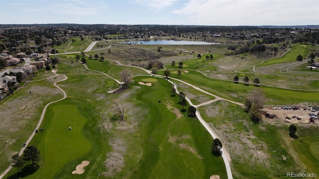 bird's eye view with a residential view, view of golf course, and a water view