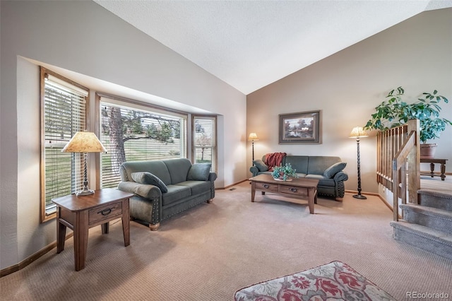 living room with carpet floors, baseboards, and high vaulted ceiling
