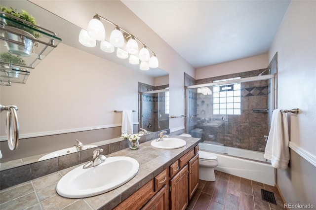 full bathroom with double vanity, visible vents, and a sink