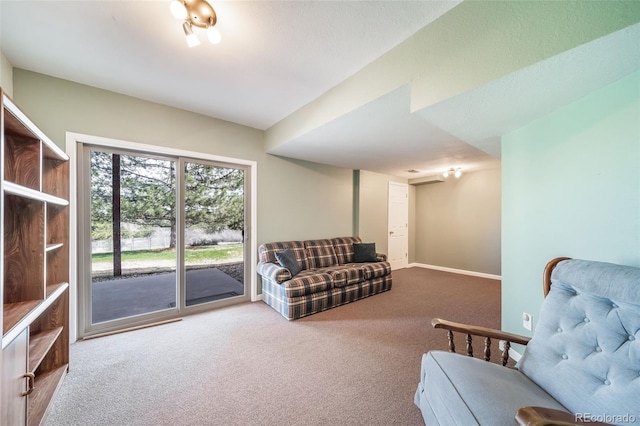 living area with carpet flooring and baseboards