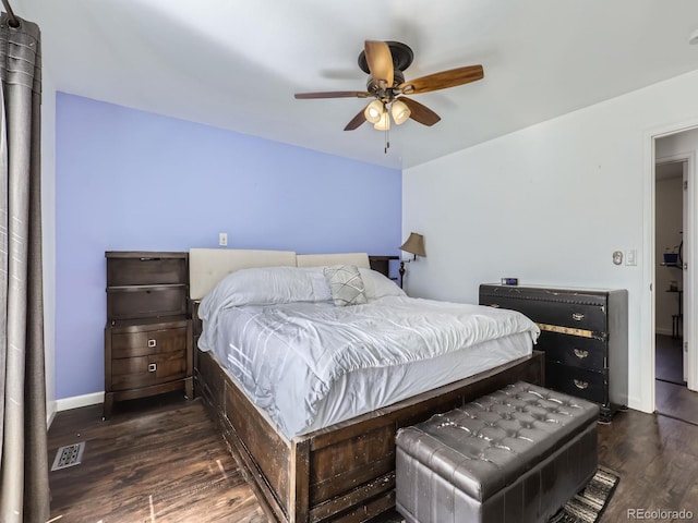 bedroom featuring dark hardwood / wood-style floors and ceiling fan