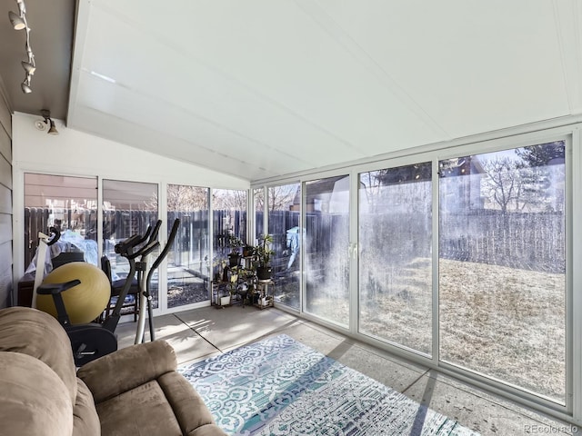 sunroom featuring a wealth of natural light and vaulted ceiling