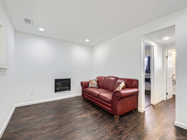 living room featuring dark hardwood / wood-style floors