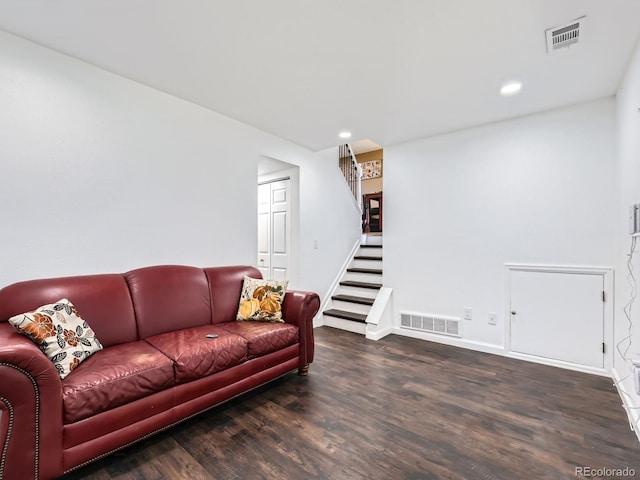 living room featuring dark hardwood / wood-style flooring