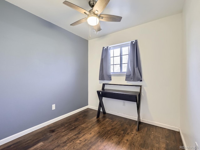 empty room with dark hardwood / wood-style floors and ceiling fan