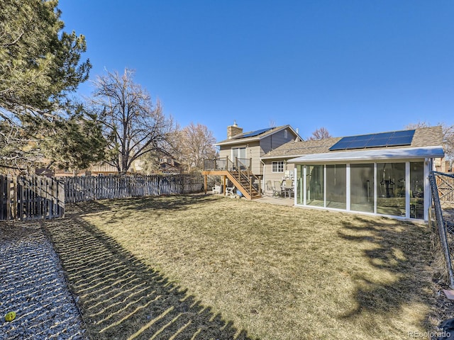 view of yard with a sunroom