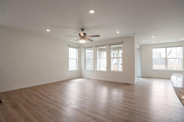24314 E Ford Ave, Aurora, CO 80018 - unfurnished living room with a ceiling fan, wood finished floors, recessed lighting, and baseboards