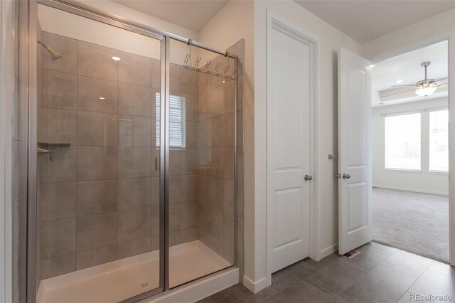 24314 E Ford Ave, Aurora, CO 80018 - full bathroom with a shower stall, baseboards, and tile patterned flooring