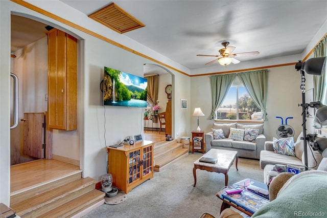 living room with light wood-type flooring and ceiling fan