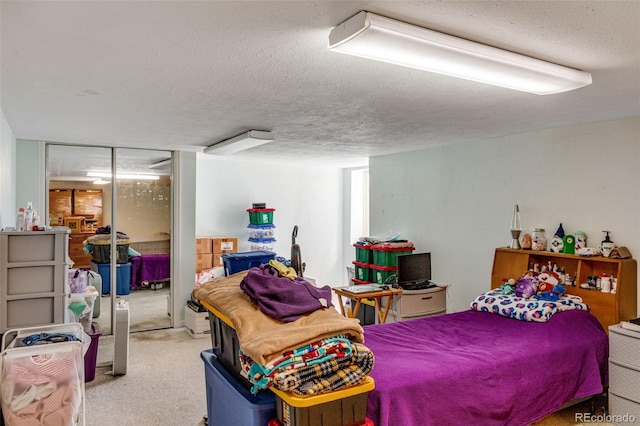 carpeted bedroom featuring a textured ceiling