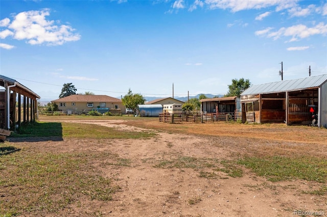 view of yard with an outdoor structure