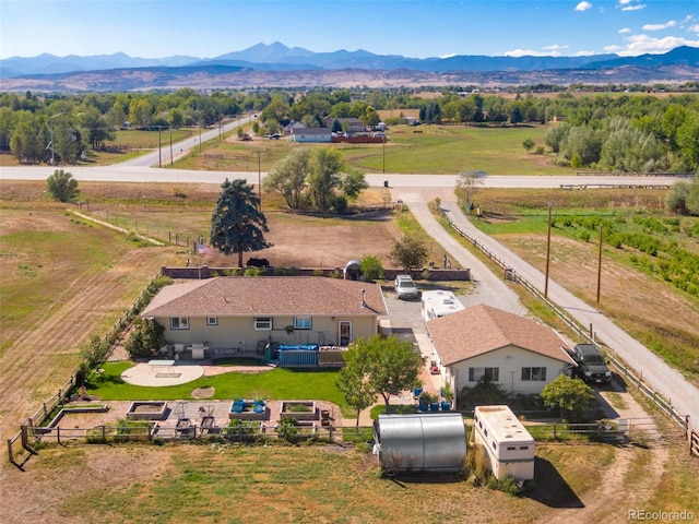 birds eye view of property with a mountain view and a rural view