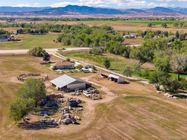 birds eye view of property featuring a mountain view and a rural view