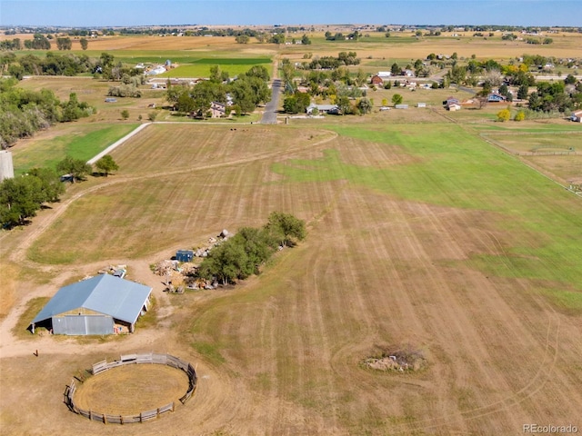 birds eye view of property with a rural view