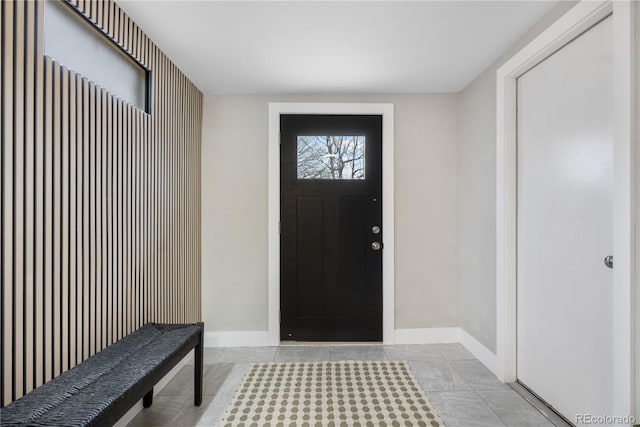 foyer entrance featuring light tile patterned flooring