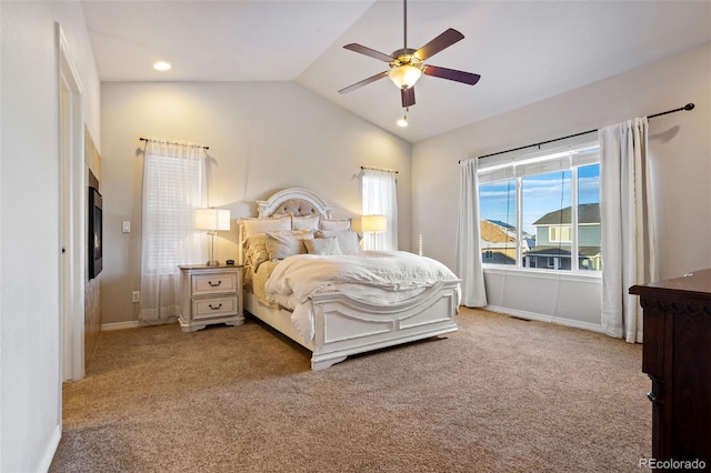 carpeted bedroom featuring vaulted ceiling and ceiling fan