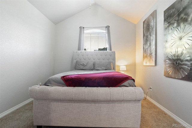 bedroom featuring lofted ceiling and carpet flooring