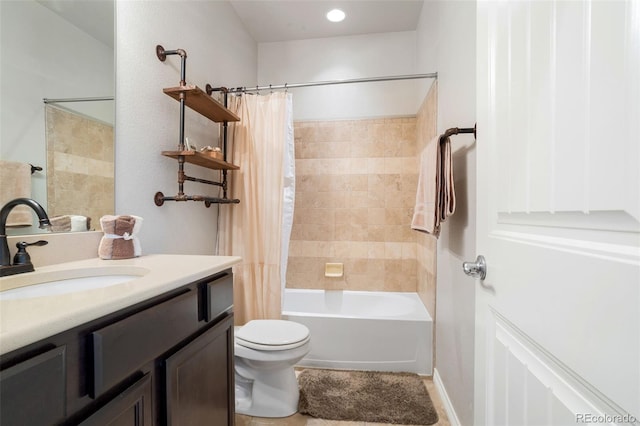 full bathroom featuring shower / tub combo, vanity, and toilet