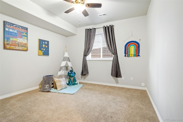 rec room with ceiling fan and carpet floors