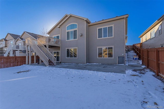 view of snow covered house