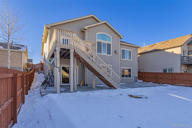 view of snow covered house