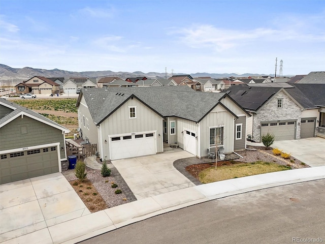 8985 Chalk Creek Pl, Littleton, CO 80125 - view of front of home featuring board and batten siding, a shingled roof, a residential view, stone siding, and driveway