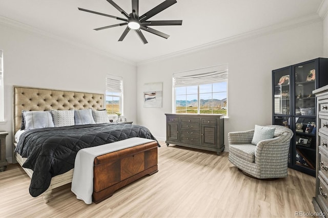 8985 Chalk Creek Pl, Littleton, CO 80125 - bedroom featuring ornamental molding, light wood-type flooring, and ceiling fan