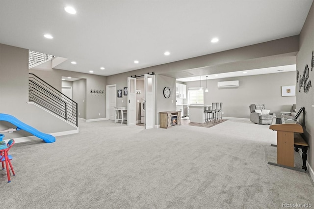 8985 Chalk Creek Pl, Littleton, CO 80125 - workout area featuring an AC wall unit, carpet flooring, baseboards, and recessed lighting