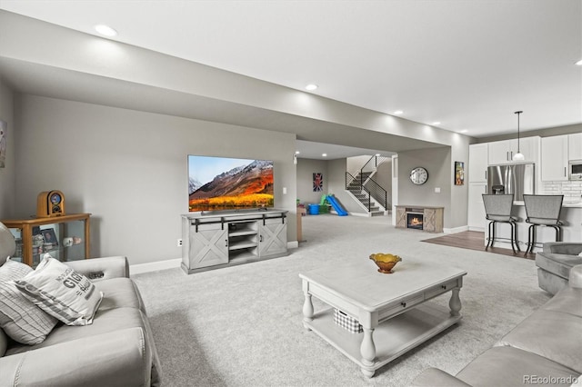 8985 Chalk Creek Pl, Littleton, CO 80125 - living room with stairs, light colored carpet, baseboards, and recessed lighting