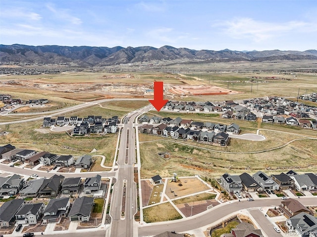 8985 Chalk Creek Pl, Littleton, CO 80125 - aerial overview of property's location with nearby suburban area and a mountain backdrop