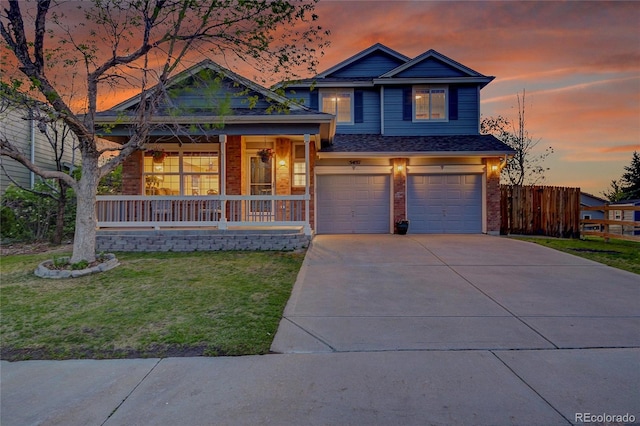 5457 S Valdai St, Aurora, CO 80015 - view of front facade featuring a porch, an attached garage, brick siding, concrete driveway, and roof with shingles
