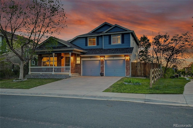 5457 S Valdai St, Aurora, CO 80015 - view of front of property with brick siding, covered porch, driveway, and a garage