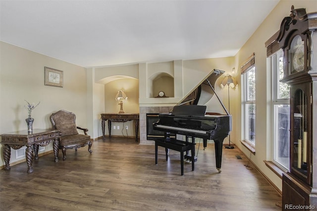 5457 S Valdai St, Aurora, CO 80015 - living area with a fireplace, wood finished floors, and baseboards