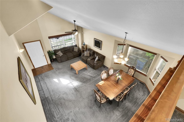 5457 S Valdai St, Aurora, CO 80015 - living room with carpet flooring, a chandelier, high vaulted ceiling, and a ceiling fan