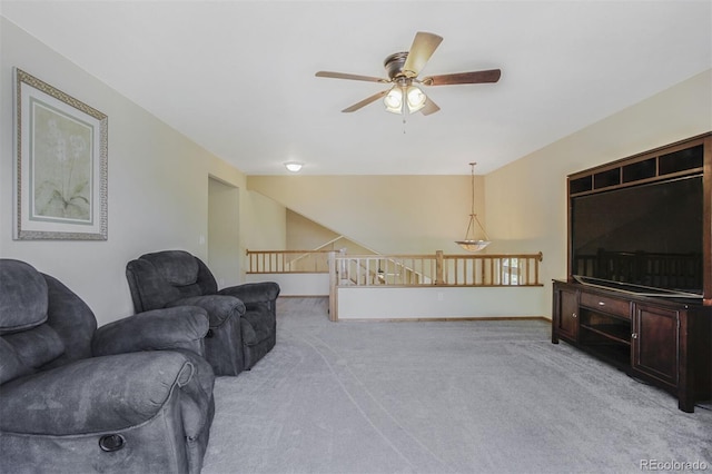 5457 S Valdai St, Aurora, CO 80015 - living area featuring a ceiling fan, light colored carpet, vaulted ceiling, and baseboards