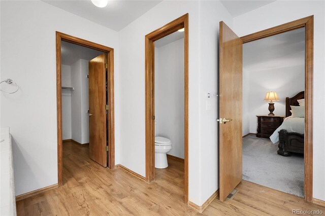 5457 S Valdai St, Aurora, CO 80015 - corridor featuring light wood-style flooring and baseboards
