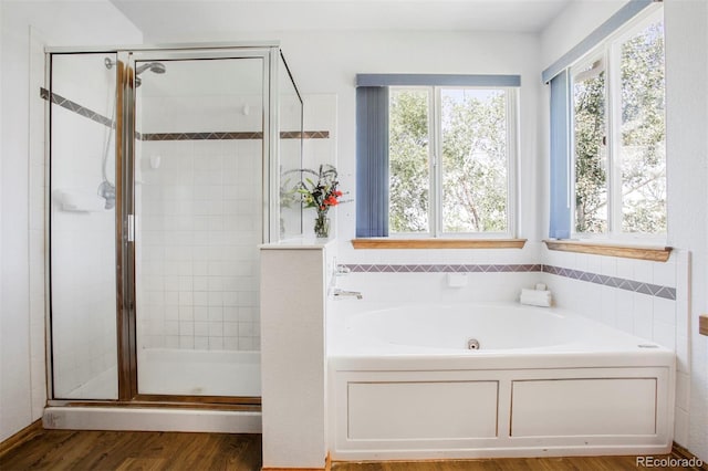 5457 S Valdai St, Aurora, CO 80015 - full bath with a tub with jets, healthy amount of natural light, and a shower stall